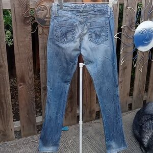 Woman's jeans plastic by g L. Y. Distressed, wrinkled. Some stretch.